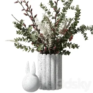 Bouquet with eucalyptus flowers in a white vase