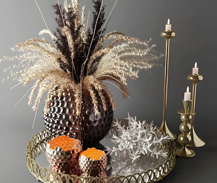 Bouquet of dried flowers in a glass vase on a tray