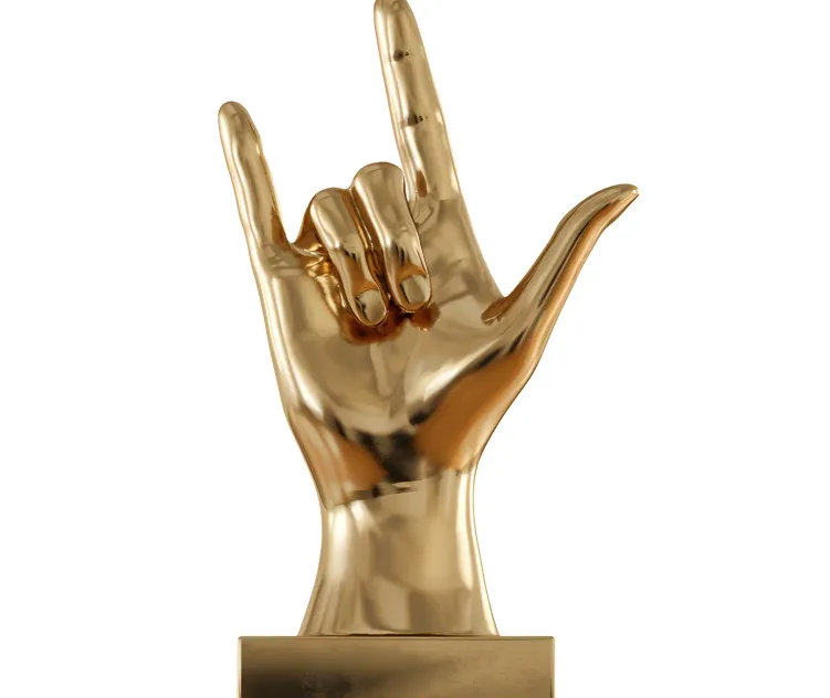 Figurine hand rock on table top